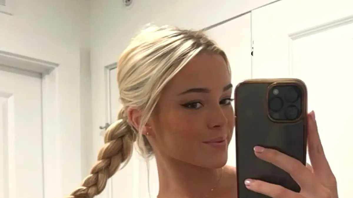 A stunning new outfit from Olivia Dunne wows her fans yet again as she watches MLB superstar boyfriend Paul Skenes
