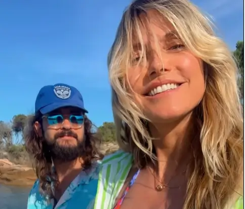 Heidi Klum showed off her amazing figure on a beach getaway wearing a pink and blue floral bikini
