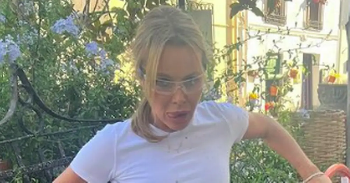 Amanda Holden works up a sweat in a tiny white top – but she had followers worried about her safety