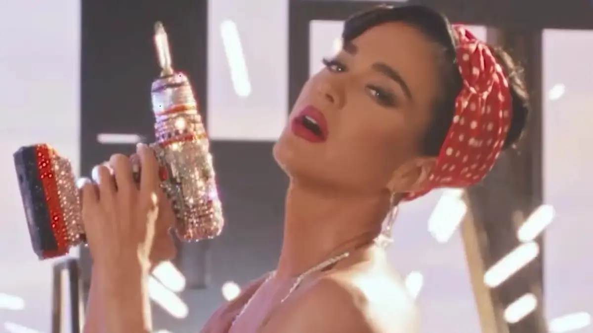 Katy Perry shows off her busty figure in a sparkly cutout red, white, and blue bra