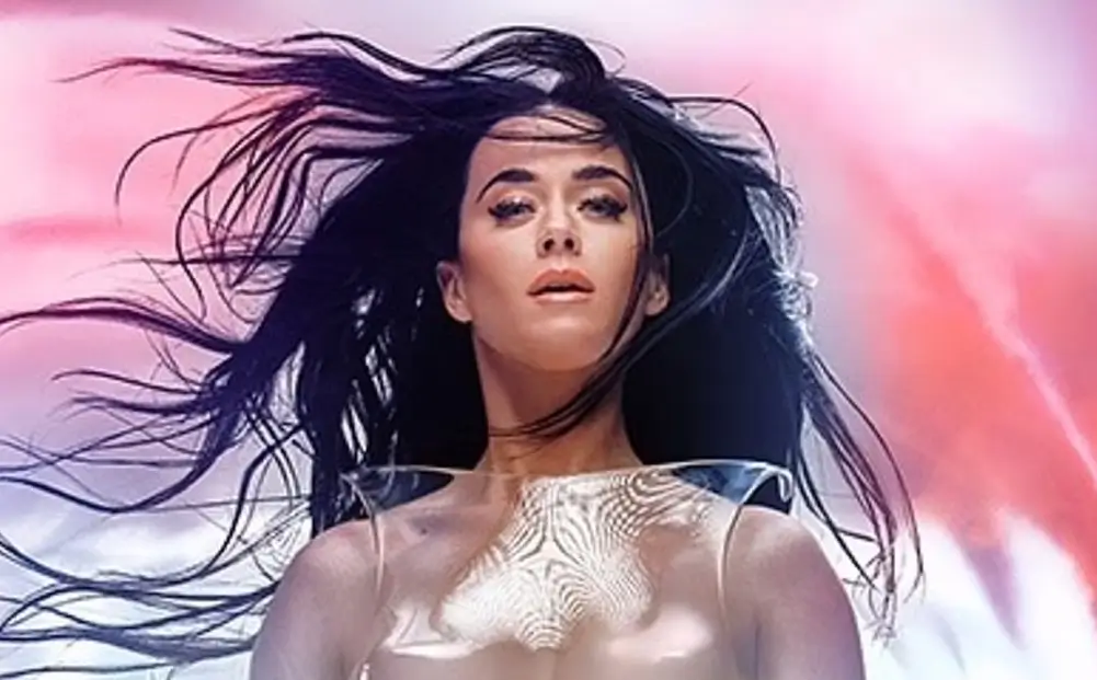 Katy Perry appears topless in a see-through iridescent skirt as she announces title and release date of her new album