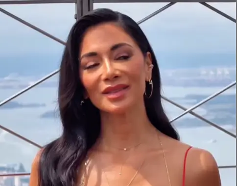 Nicole Scherzinger, 46, looked sleek and chic in a fiery red dress with spaghetti straps and heels in New York City.