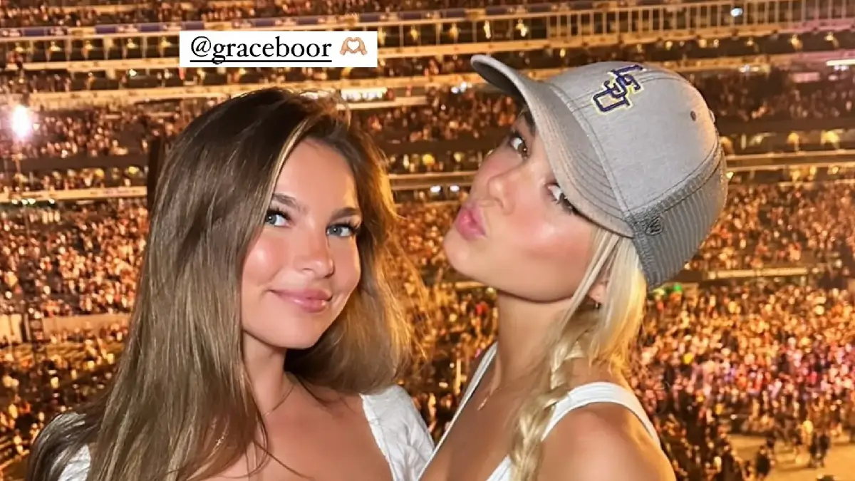 A stunner in bright white cowboy boots and jeans shorts, Olivia Dunne, 22, attended Luke Combs’ concert in New York