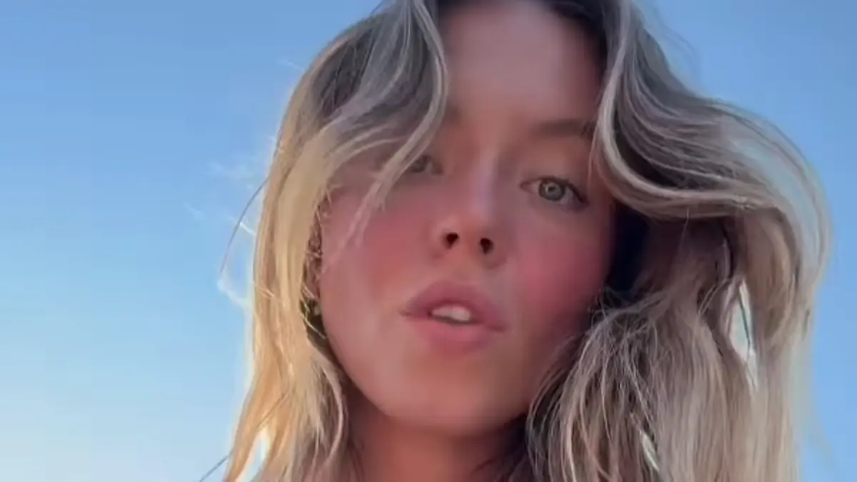 Sydney Sweeney showed off her sensational figure in a black halter swimsuit with a plunging V-neck for her sun-soaked excursion