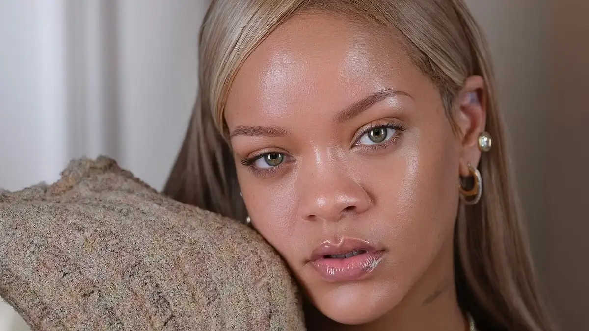 In gorgeous makeup-free portraits, Rihanna promotes a skincare line while encouraging fans to wear sunscreen