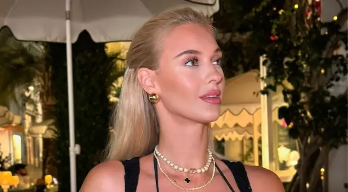 A plunging black top and matching skirt showcased Veronika’s cleavage, with cut-outs revealing her washboard abs