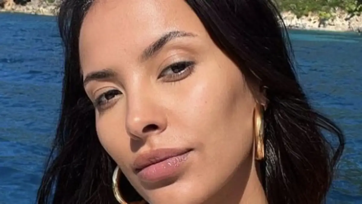 Maya Jama shared a sun-kissed selfie while away on holiday, wearing a tiny black bra and shorts for the occasion