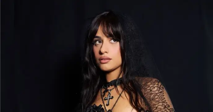 Camila Cabello returned to black hair in a tantalizingly sheer lace dress that highlighted her figure