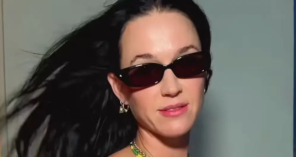 Katy Perry showed off her slimmed-down silhouette in a tiny bikini from her hotel balcony