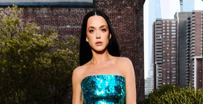 Katy Perry dazzled in a strapless, shimmering dress, her radiant smile illuminating the star-studded Caring for Women Dinner