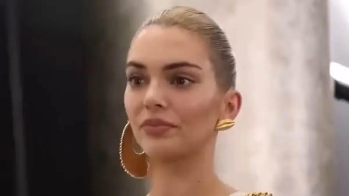 Kendall Jenner’ bust nearly spilled out of the sleeveless one-piece, which she wore with dark denim jeans