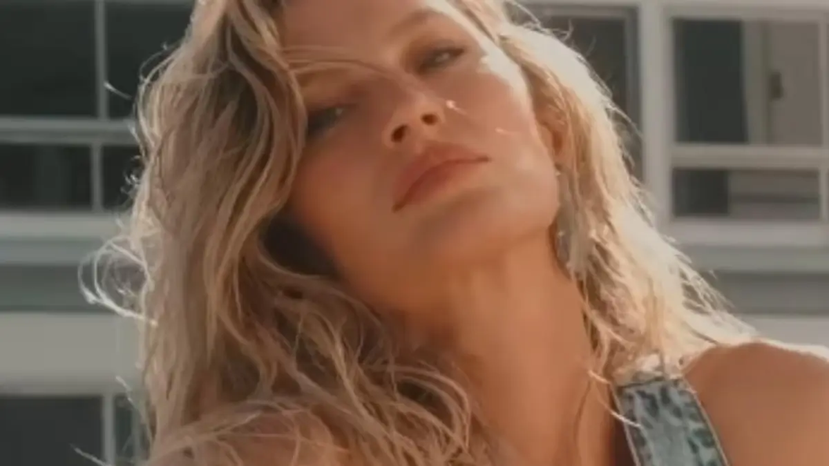 With her very toned and tanned figure, Gisele Bundchen almost spilled out of her top during a Rio shoot