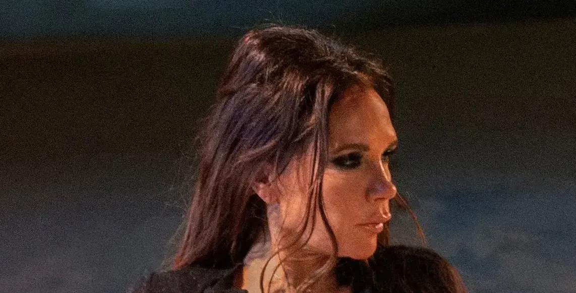 Victoria Beckham, 50, risks flashing everything in a tiny plunging black silk shirt