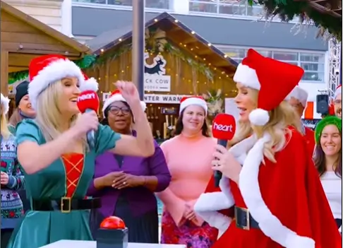 In a sexy Santa outfit and a glamorous elf outfit, Amanda Holden and Ashley Roberts celebrate Christmas early on Heart Breakfast