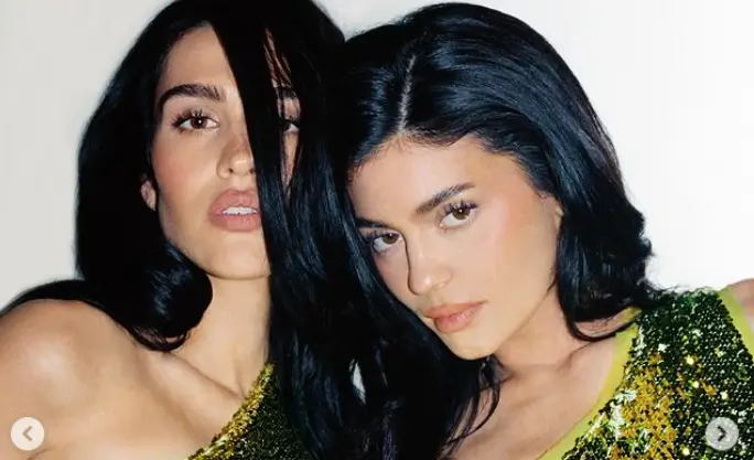 In an off-the-shoulder crop top with a sequined fabric crossing her belly, Kylie Jenner showed off her toned midriff