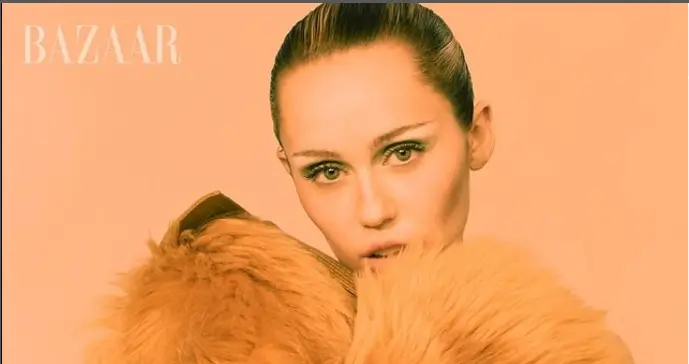 Miley Cyrus showed off her toned figure in stretchy gold underwear as she poses for the camera