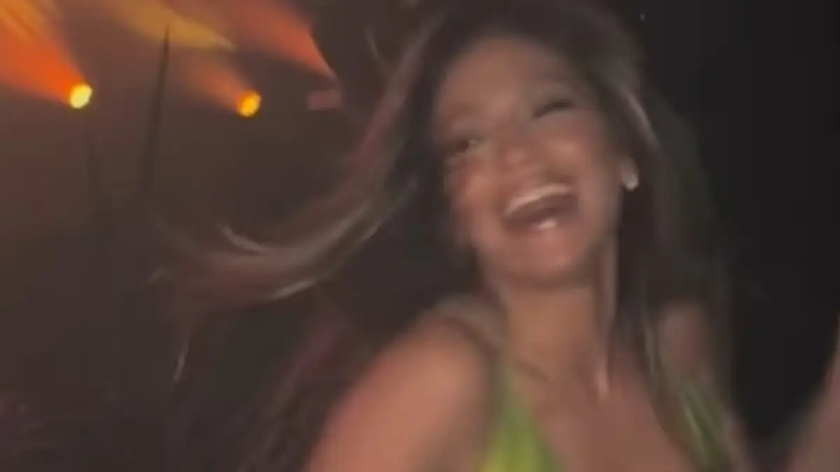 Jennifer Lopez shows off her curvaceous figure and stunning bust in a sexy neon green dress