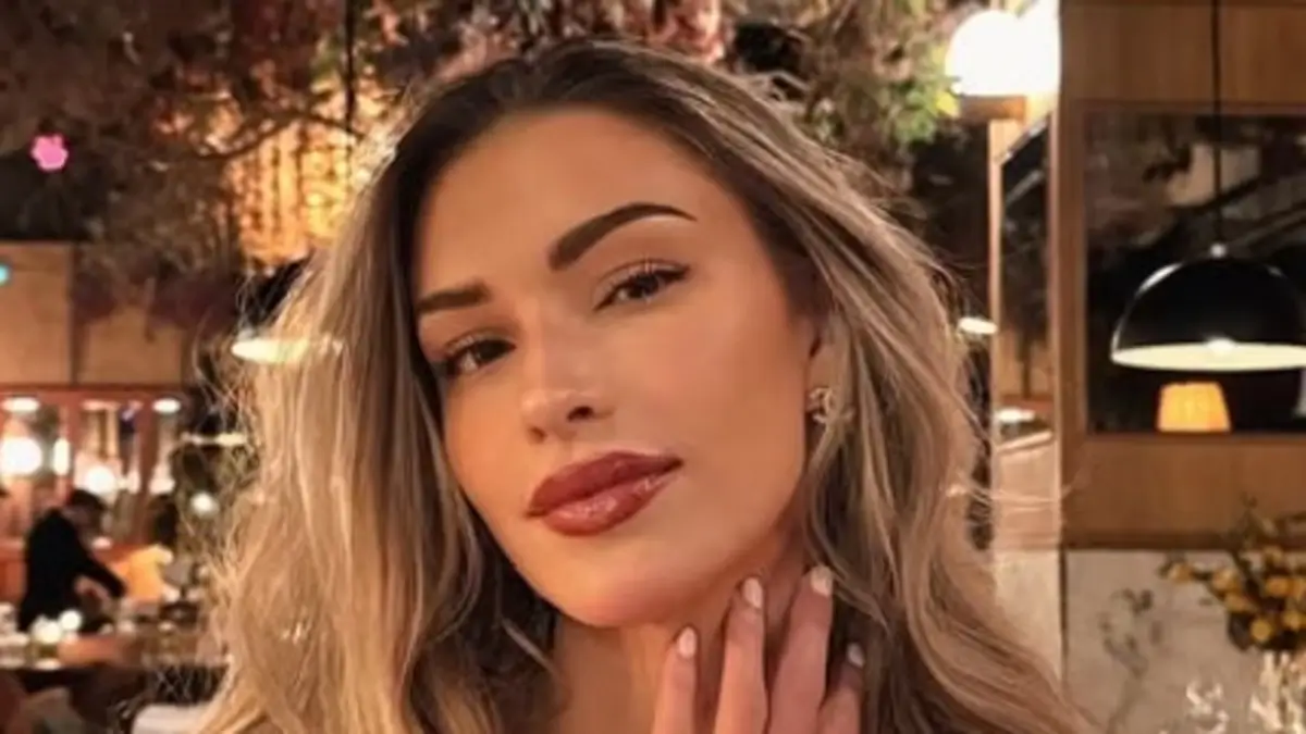 Zara McDermott showed off her glowing in a bold and plunging red dress at a fancy dinner in Paris