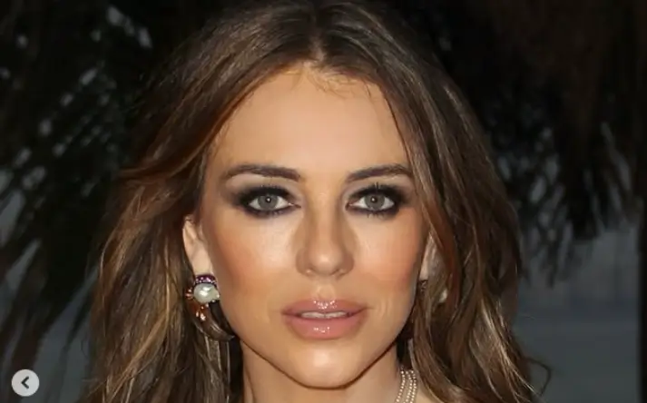 Liz Hurley flaunted her beauty and grace in a gorgeous pink and white backless dress as she effortlessly posed for stunning snaps