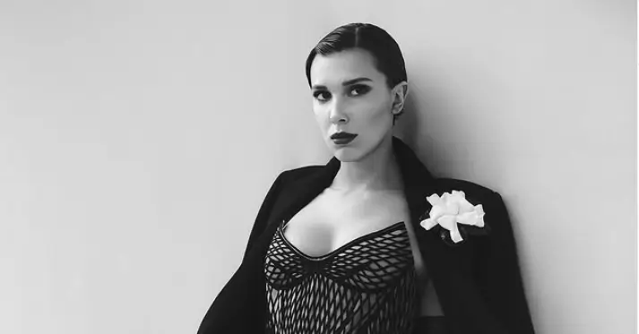 For a truly standout look, Millie Bobby Brown opts for a white high-cut bodysuit that accentuates her sleek figure