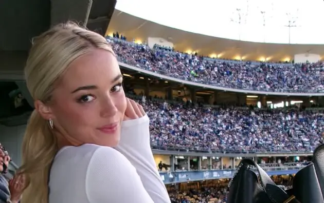 Olivia Dunne dazzles in a chic white cropped top with long sleeves showcases her incredible figure