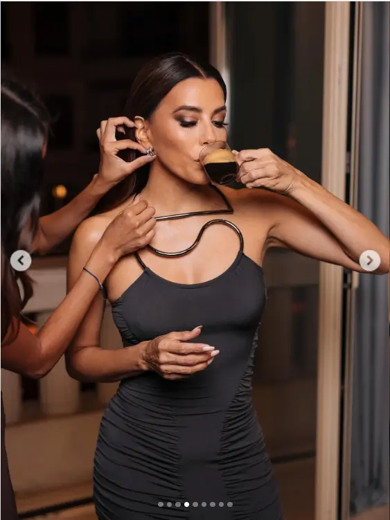Her choice of attire, a skintight, see-through dress in gray, accentuated her toned muscles and curves. Paired with a glam maxi number, Eva's look was both daring and elegant.