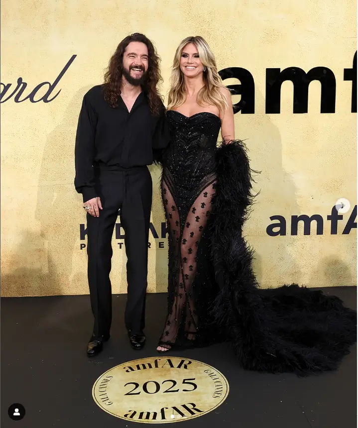 Heidi Klum, a paragon of elegance, dazzles in a stunning racy black mesh gown, gracing the amfAR Gala at the 78th Cannes Film Festival. This spectacle, held at the illustrious Hotel du Cap-Eden-Roc, brought together the crème de la crème of the film and fashion industries.