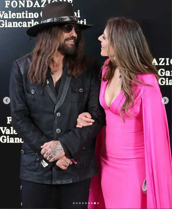 Hollywood stars Elizabeth Hurley and Billy Ray Cyrus stole the spotlight during their red carpet debut at an exclusive Valentino event in Rome on Saturday evening.