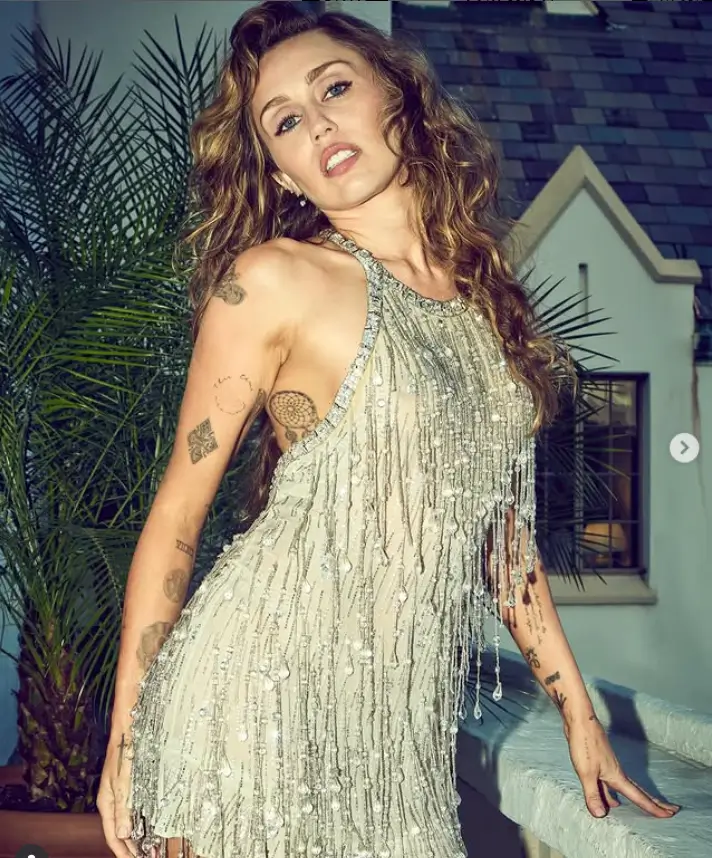 Miley Cyrus captivated the audience at her star-studded album listening party on Tuesday evening. She donned a gorgeous fringed halterneck minidress, a choice that underscored her bold and daring style.