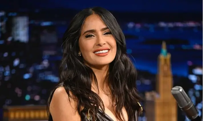 Salma Hayek captivated audiences with a skintight leather minidress, accentuated her curves and drew attention to her cleavage