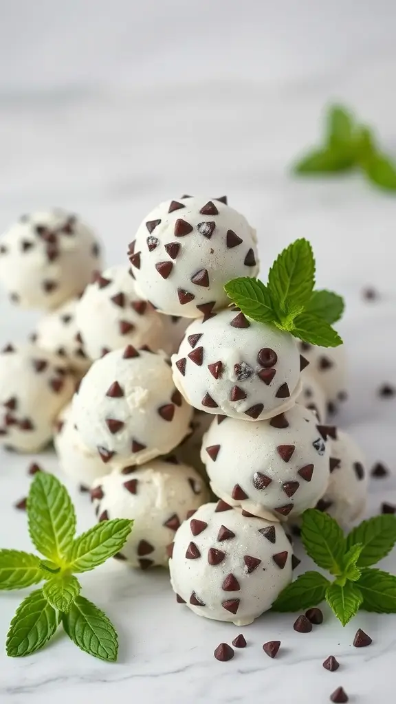 Mint Chocolate Chip Fat Bombs stacked with mint leaves - 18 Low-Carb Keto Fat Bombs