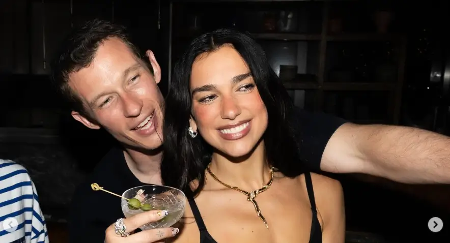 Dua Lipa shows off her stunning physique in a daring sheer dress while partying the night away